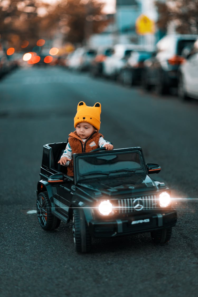 Child Driving An Electric Car