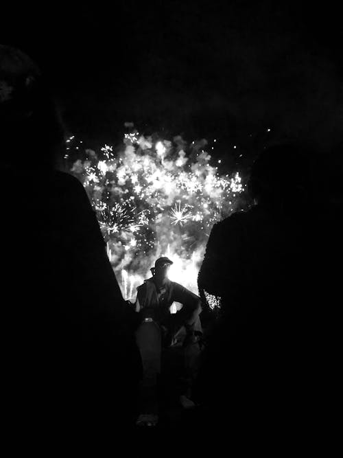 Free Grayscale Photography of Person Standing in Front of Light Stock Photo