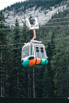 Cable car ride amidst the lush forests and mountain views of Banff National Park.