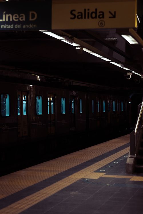 Free Dimly lit Buenos Aires subway station showcasing a train at platform Linea D. Stock Photo