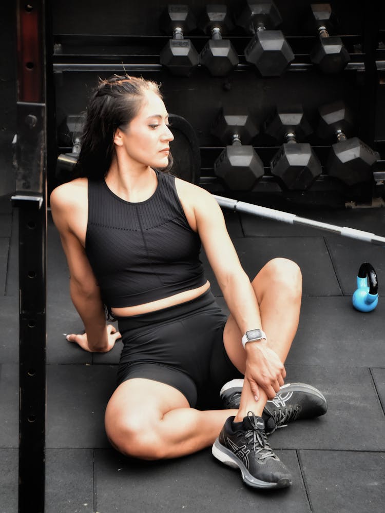 A Woman Sitting In The Gym