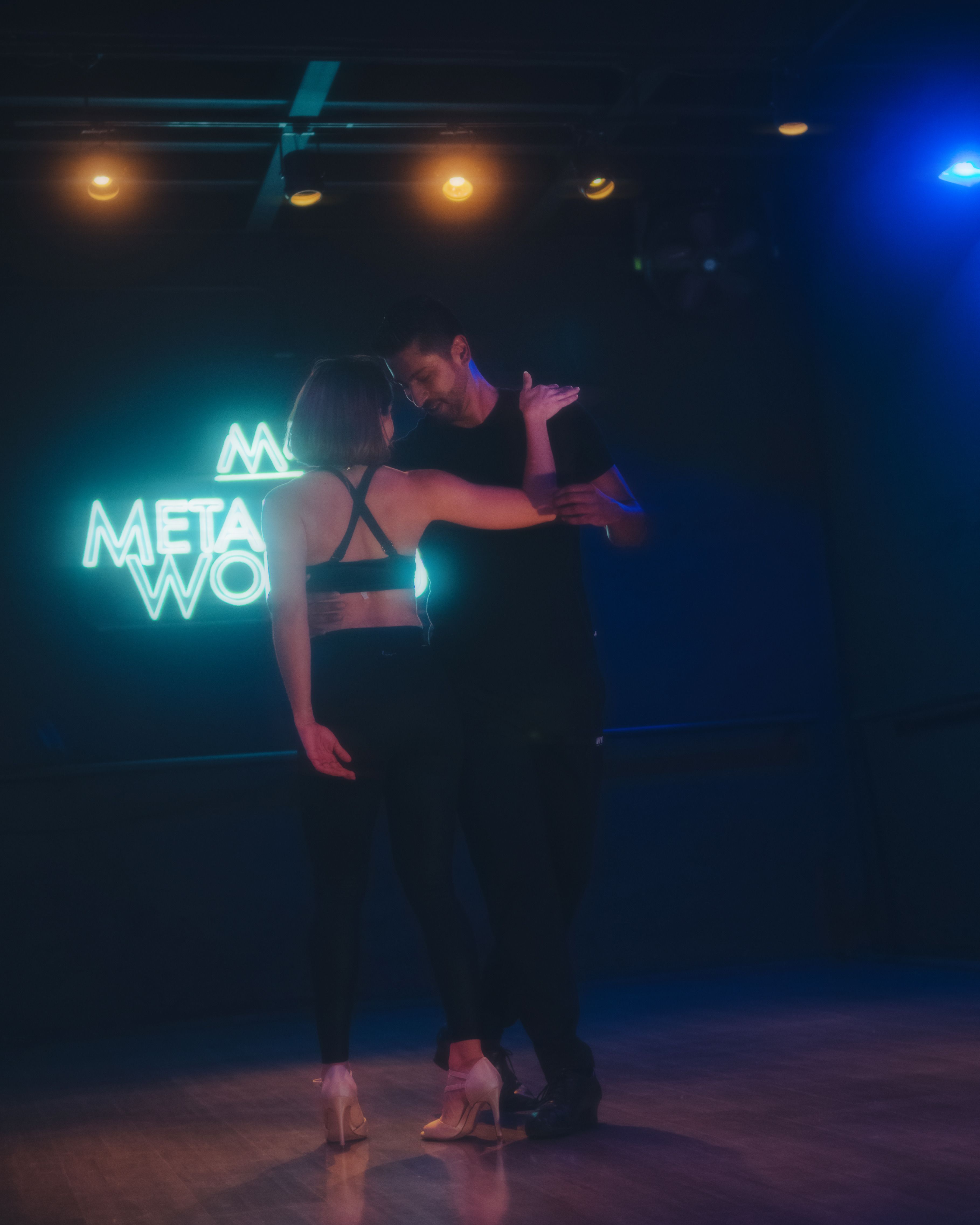 Couple embracing while dancing in a studio