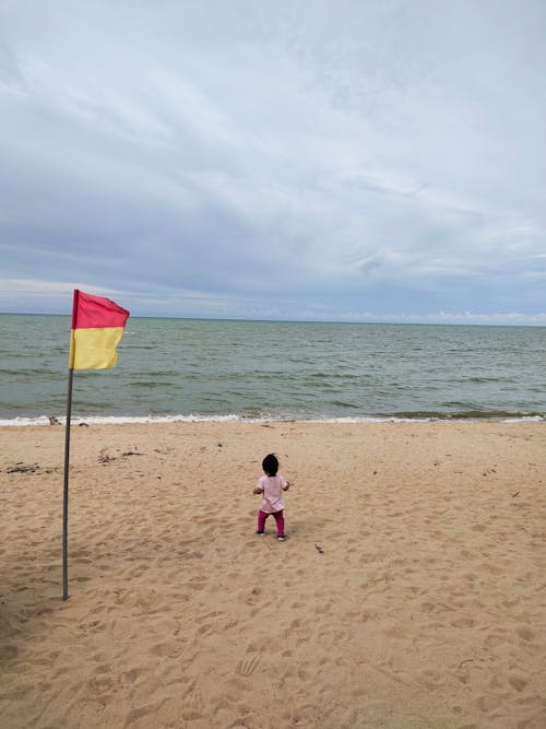 A Kid Standing on the Shore