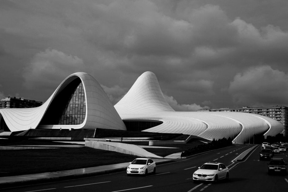 Grayscale image of the iconic Heydar Aliyev Center in Baku, featuring modern architectural design.