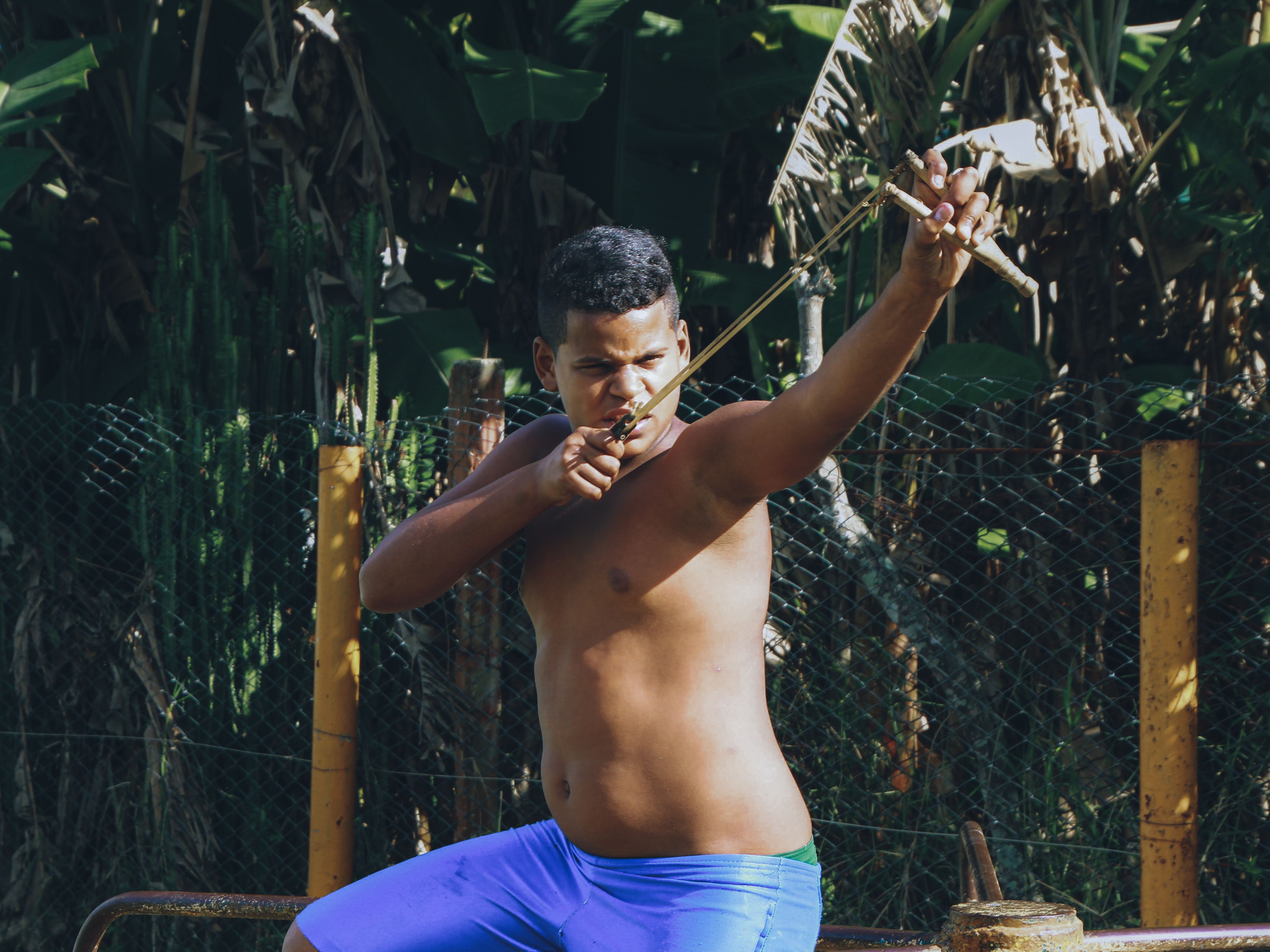 Shirtless Boy Man Using a Sling · Free Stock Photo