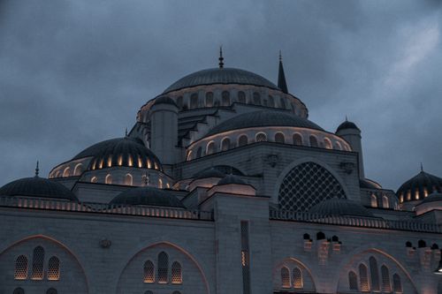 Free Stunning view of the illuminated Camlica Mosque against a moody evening sky in Istanbul, Turkey. Stock Photo