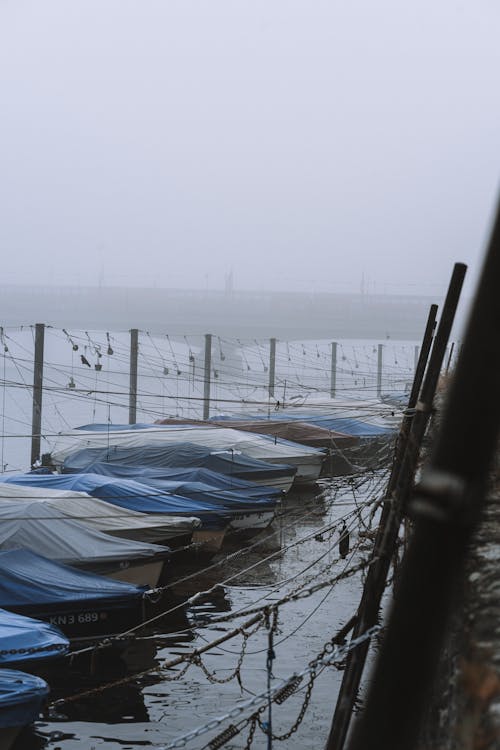 Boats Moored in the Port on a Cloudy and Foggy Day 