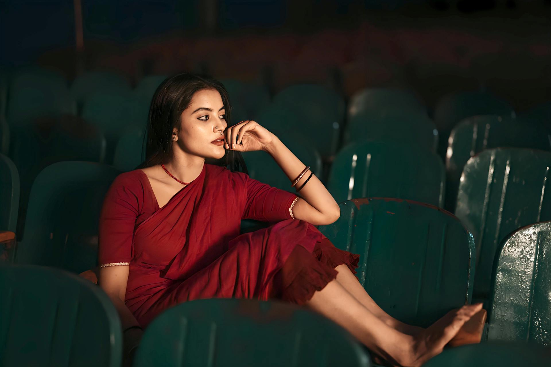 Woman in Red Dress in a Movie Theater