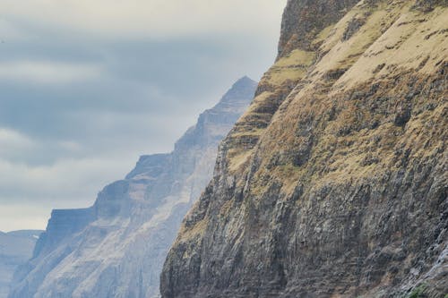 Free stock photo of boat, cliffs, cloudy