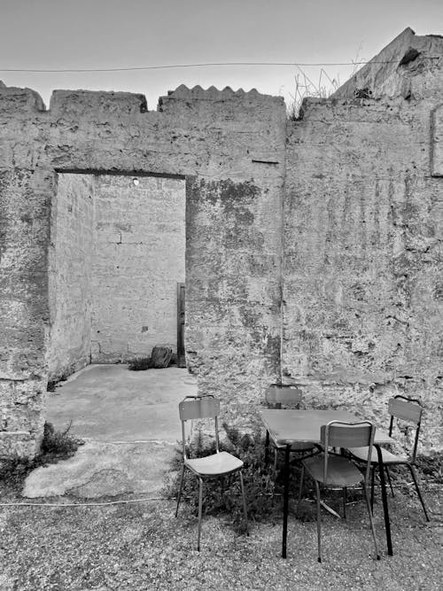 Free Table and Chairs in front of Fortress Ruins  Stock Photo