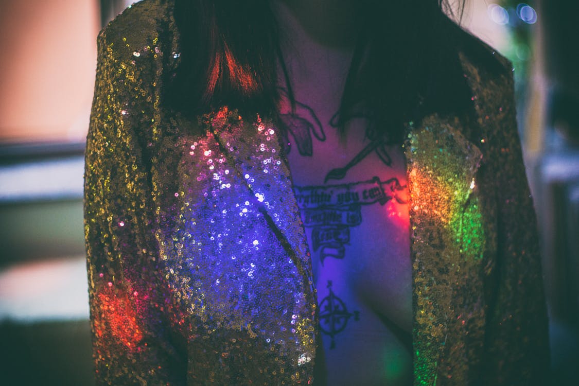 Woman Wearing Gold Glitter Suit Jacket