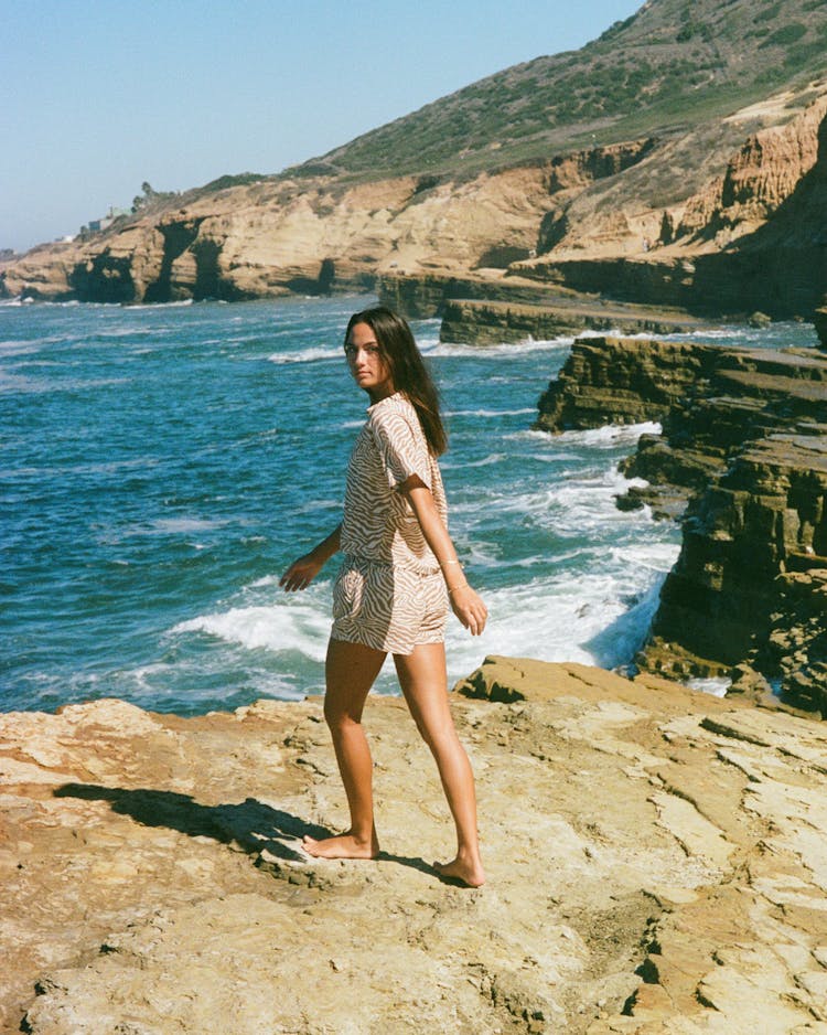 Woman On A Rocky Coast 