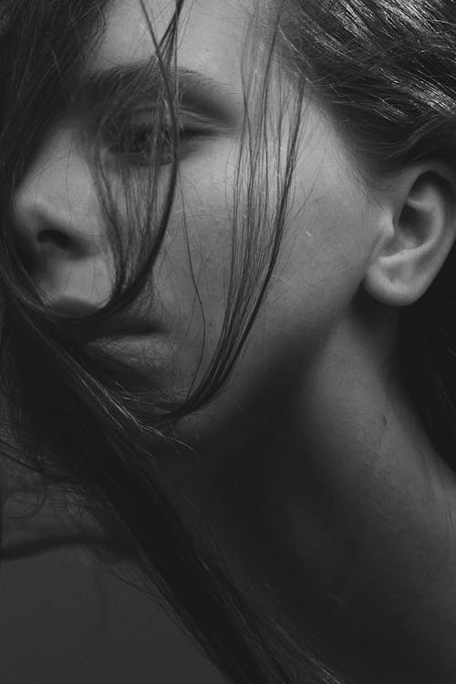 Monochrome Photography of Sad Woman