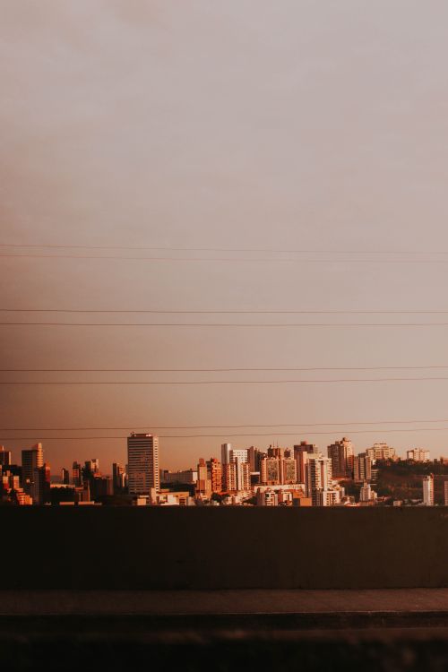 Free Sunset view of Belo Horizonte skyline with warm tones and urban landscape. Stock Photo