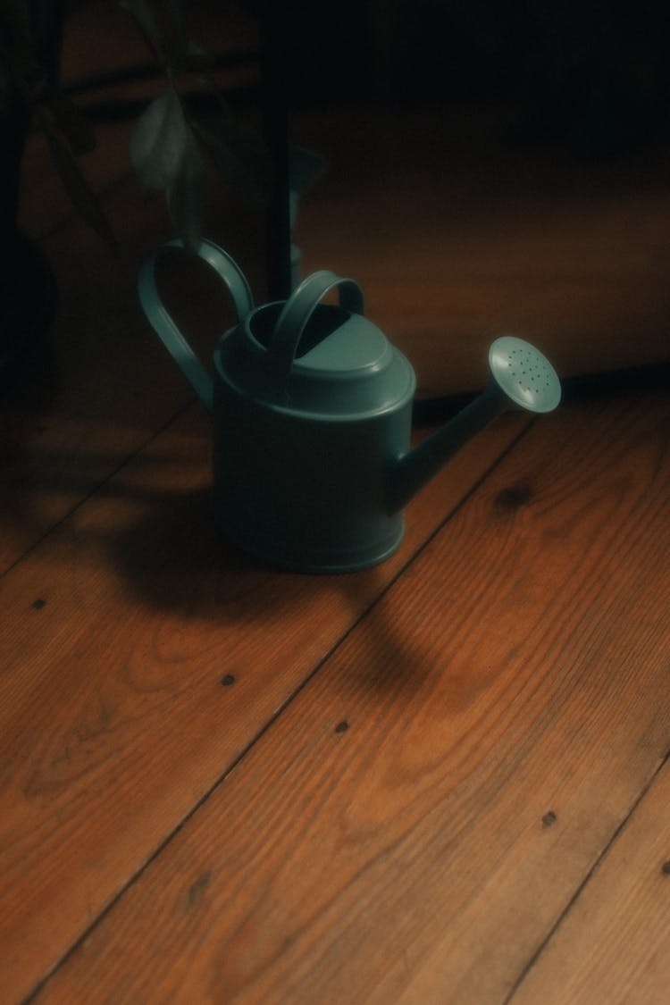 Watering Can On Floor