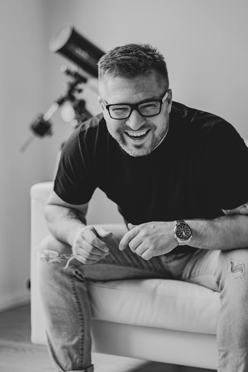 Black and White Photo of a Laughing Man 