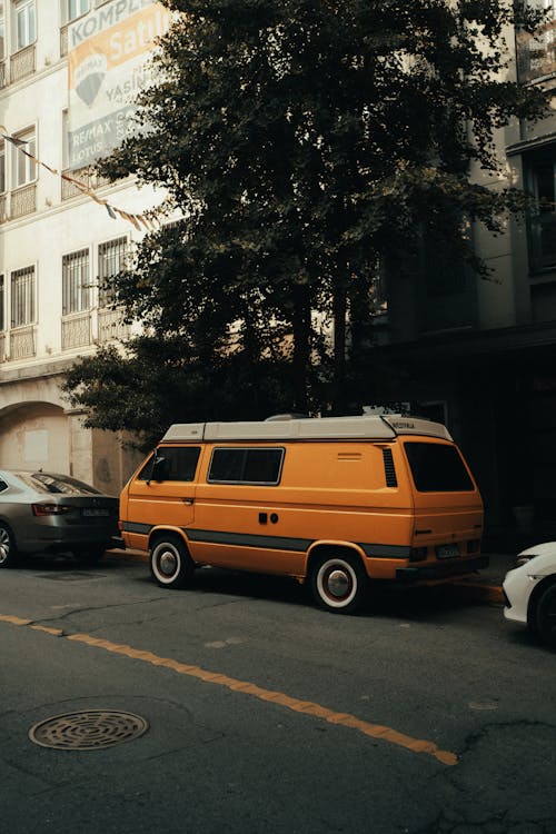Yellow Van Parked on the Side of the Road