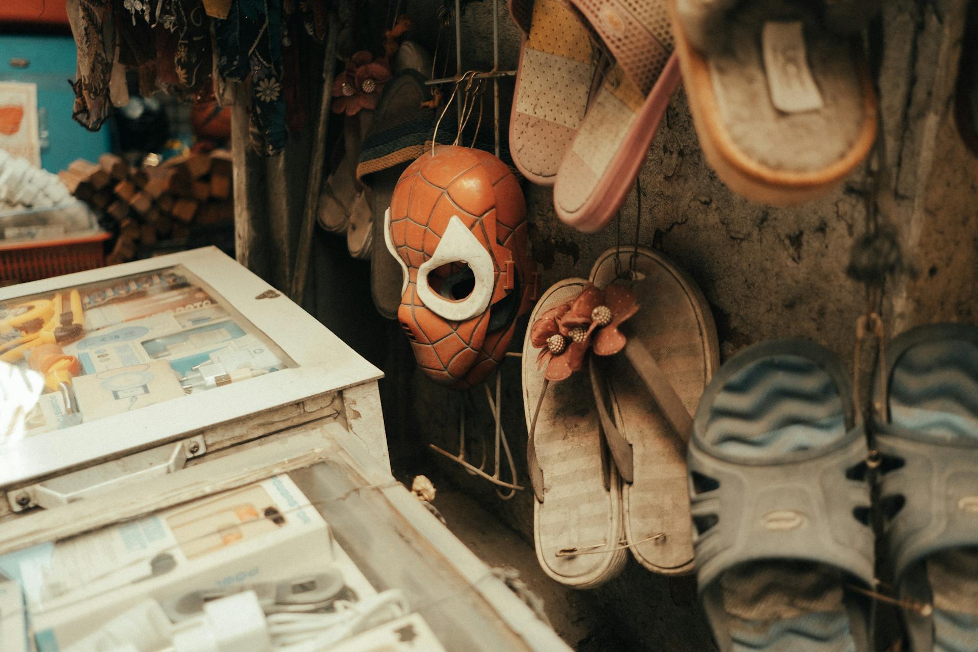 Second Hand Flip Flops and Electronics in a Dusty Store