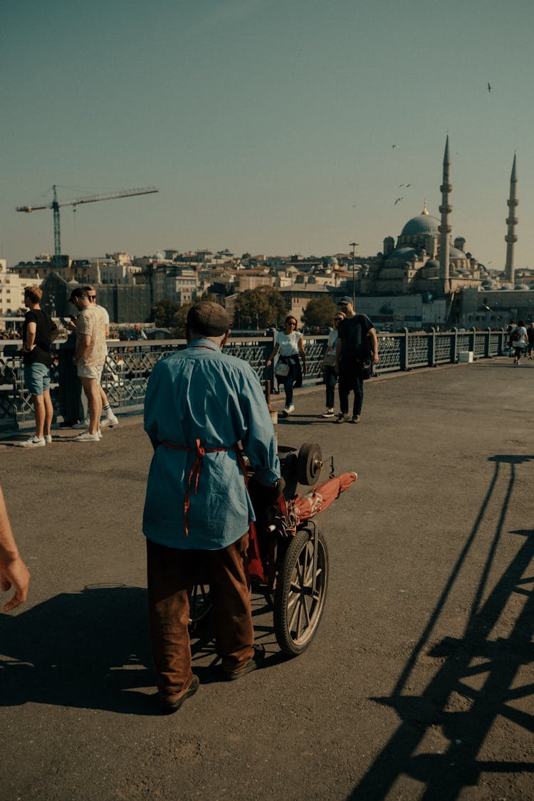 People Walking On A Bridge 