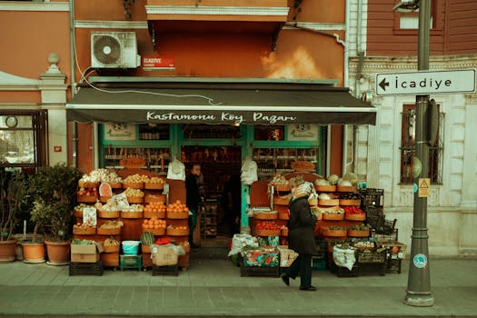 Street market stall displaying fresh fruits and vegetables in a vibrant neighborhood setting.