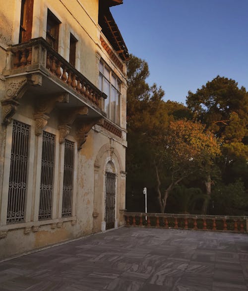 Traditional Building Exterior with Balcony and a Terrace 