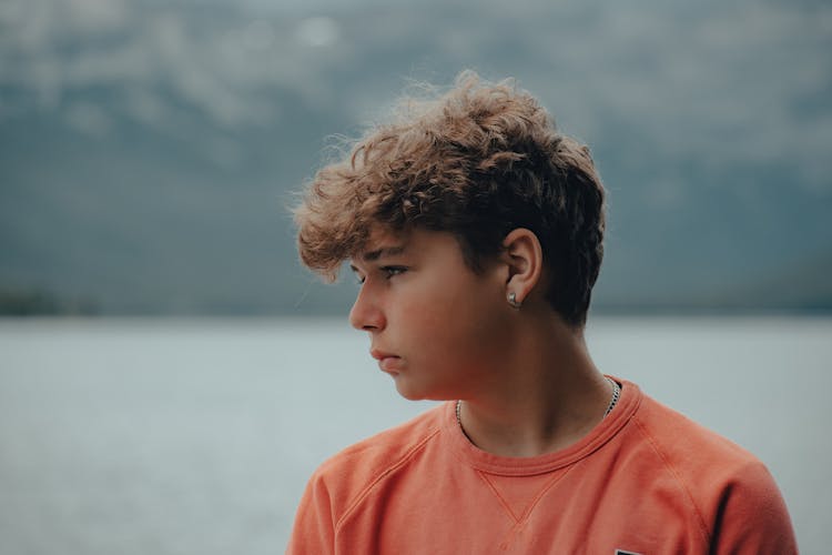 Portrait Of Plump Boy Wearing Earring