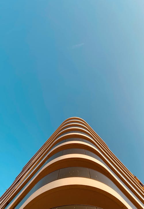 Building Exterior with Modern Architectural Design Under Blue Sky