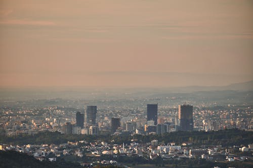 Aerial View of City Buildings During Sunset