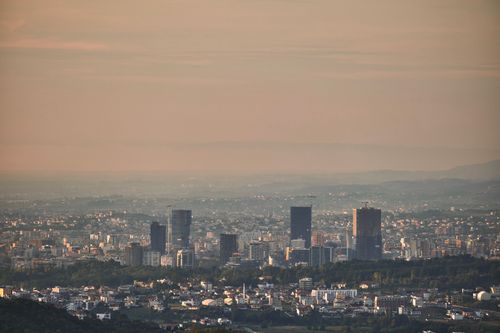 Free Skyline of Tirana, Albania at dusk showcasing skyscrapers and urban landscape. Stock Photo