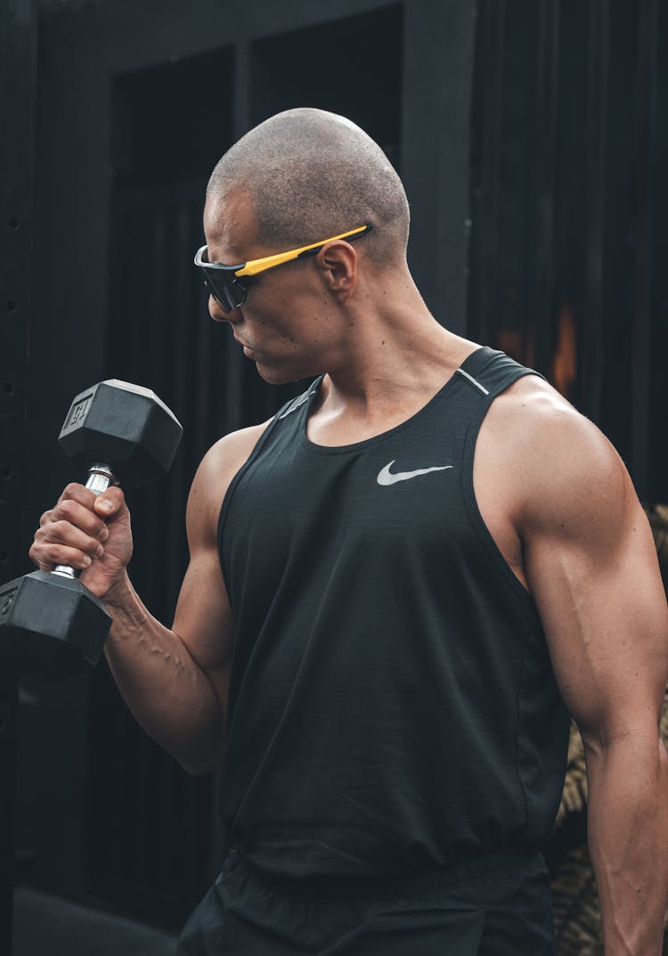 Man In Sunglasses During Workout With Dumbbell