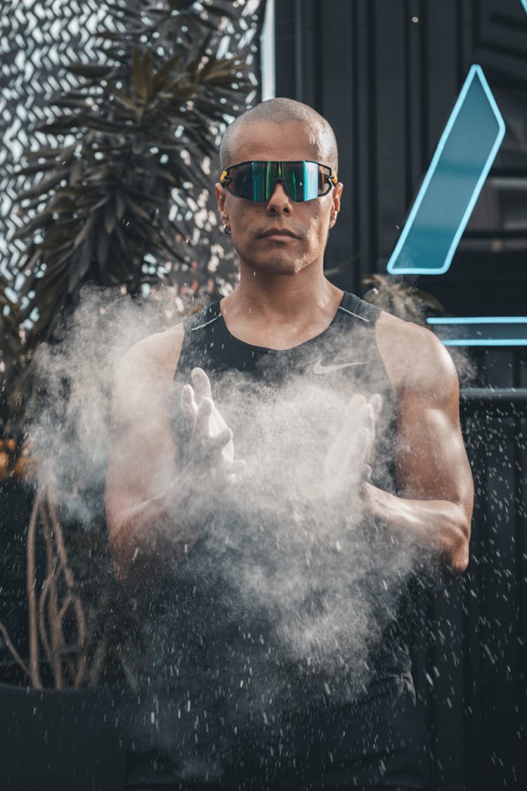 Man Using Chalk At Gym