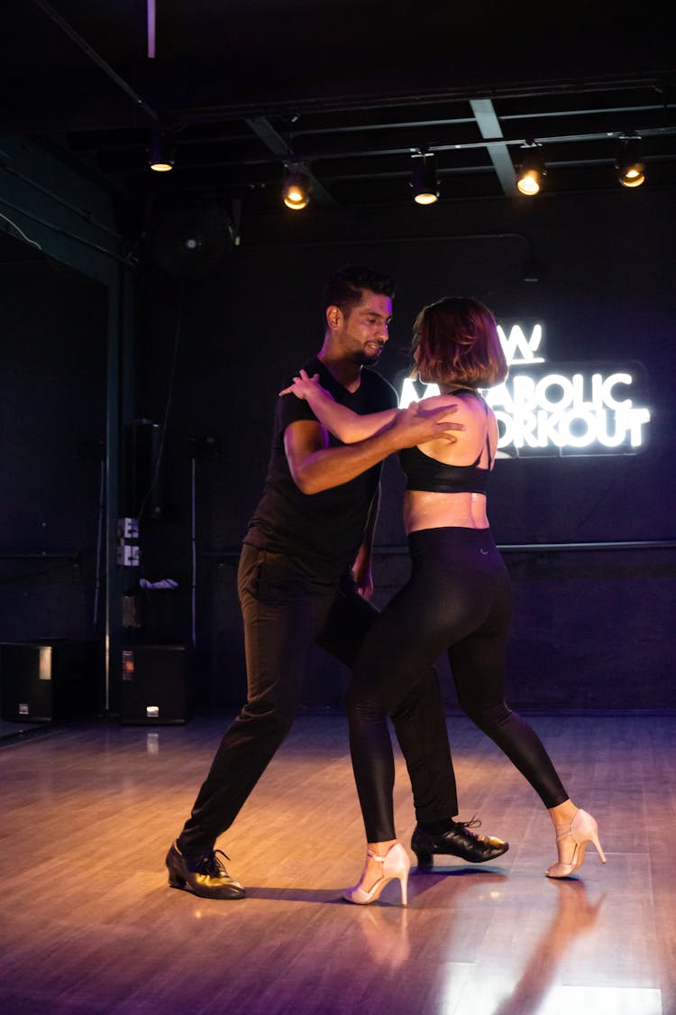 A Man And Woman Dancing Together 