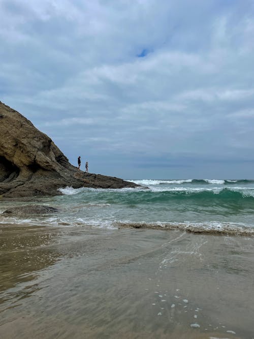 Photo of Ocean under Cloudy Sky