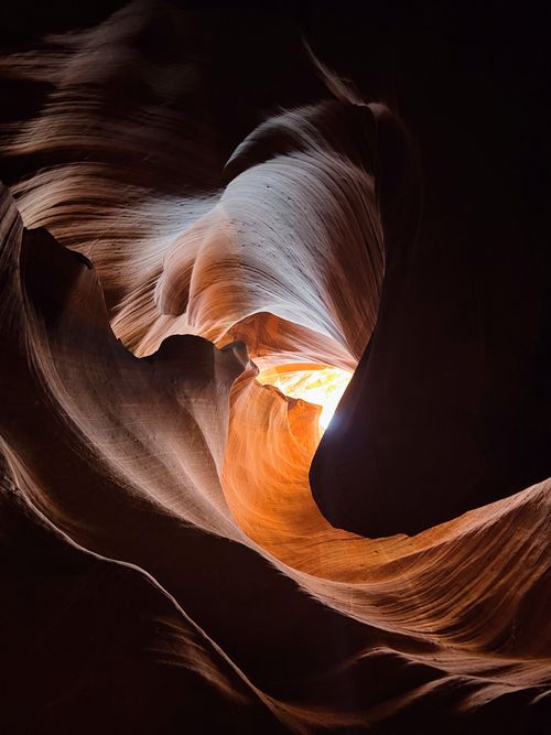 Free Stunning light shafts illuminate Antelope Canyon's sandstone formations in Arizona. Stock Photo