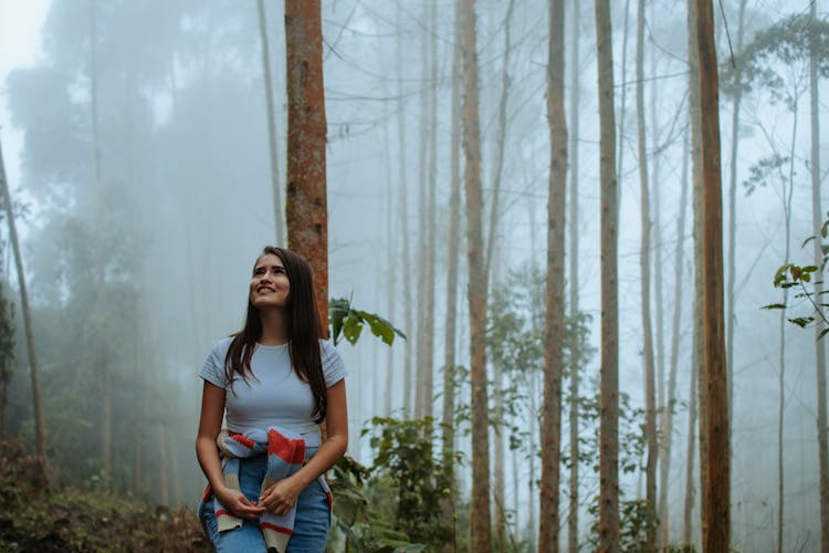 Woman In Forest Under Fog