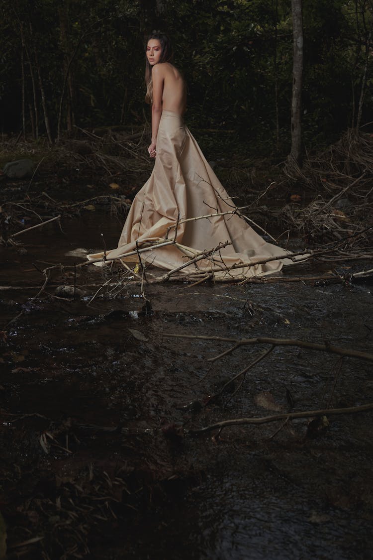 Woman Standing In A River 