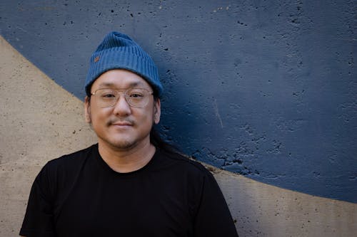 A Man Wearing Eyeglasses with Beanie Hat 