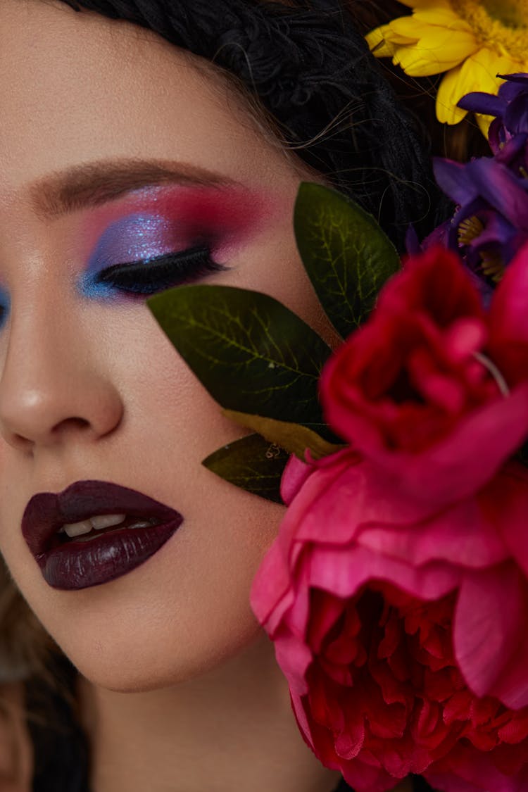 Woman With Flowers On Her Face 