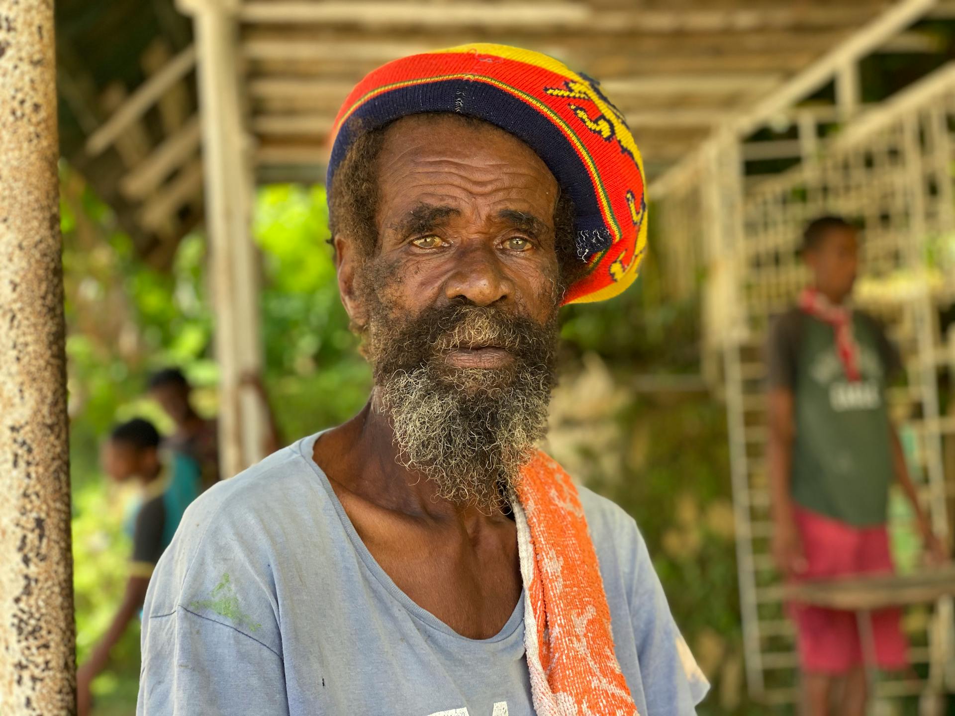 Elderly Rasta Man with Facial Hair Wearing a Rasta Tam Hat