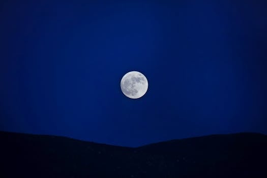 Bright full moon against a deep blue night sky in Guadalupe, Mexico. Perfect moonlit scenery.