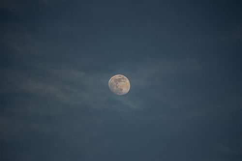 Free Captivating full moon shining brightly in the night sky over Ensenada, Mexico. Stock Photo