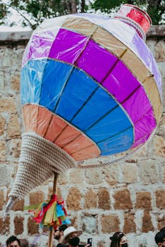 A vibrant, colorful pinata during a street festival in Oaxaca, Mexico.