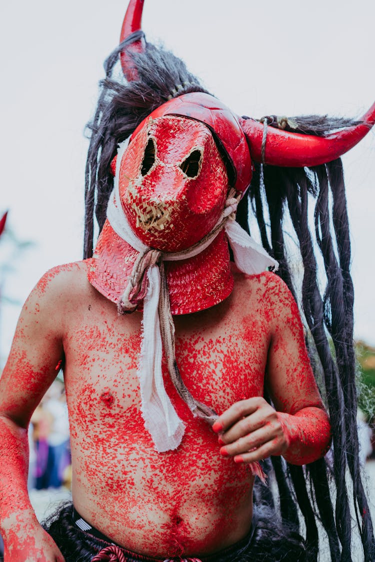 Man With Red And White Mask