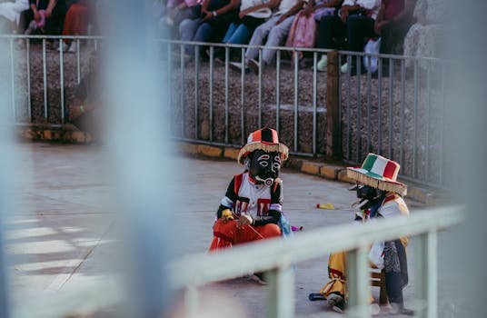 Traditional Oaxacan dancers in colorful costumes performing at a cultural festival.
