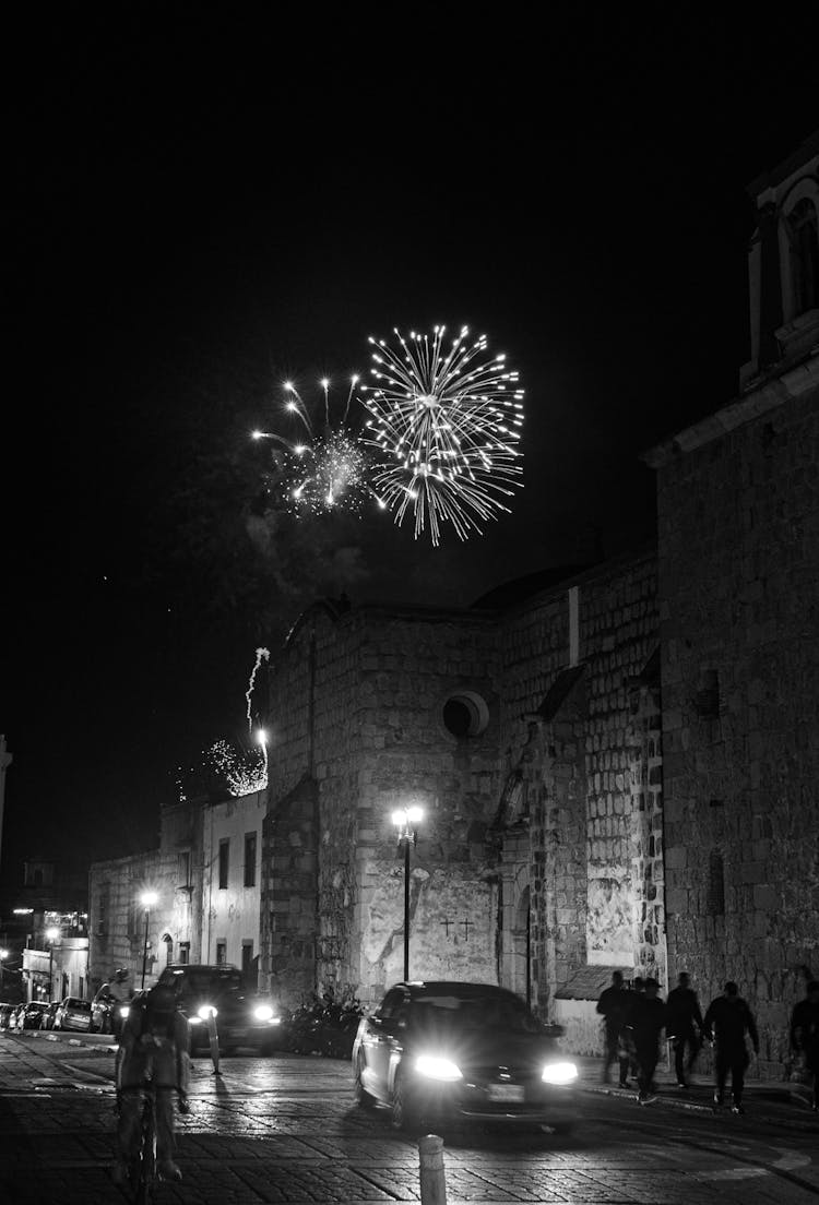 Grayscale Photo Of Fireworks In The Sky