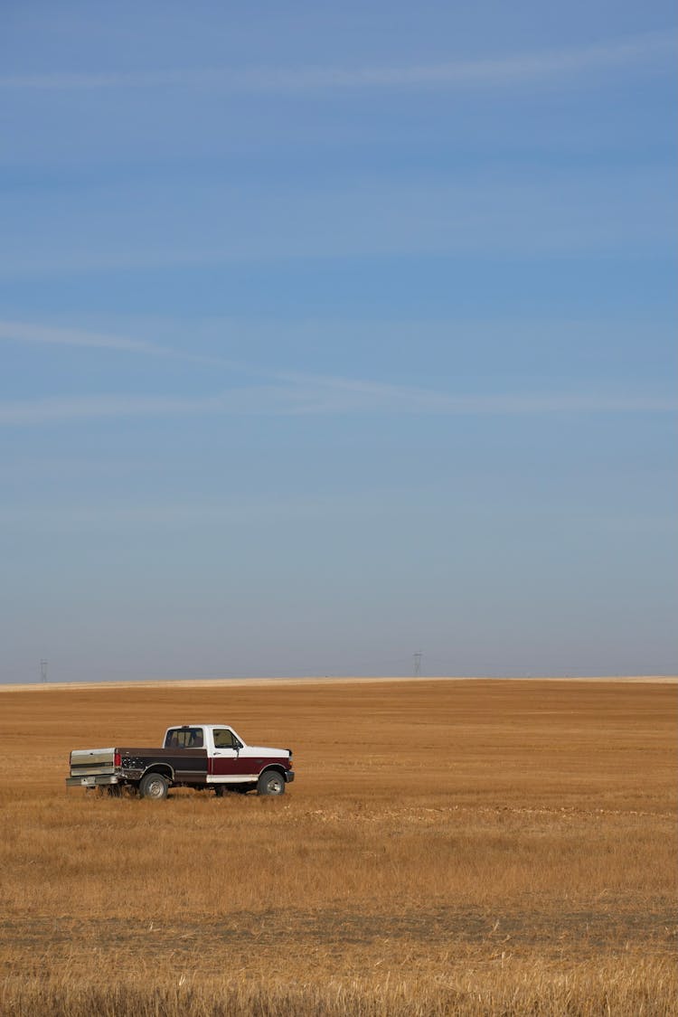 Pickup Truck Driving On Grass Field 