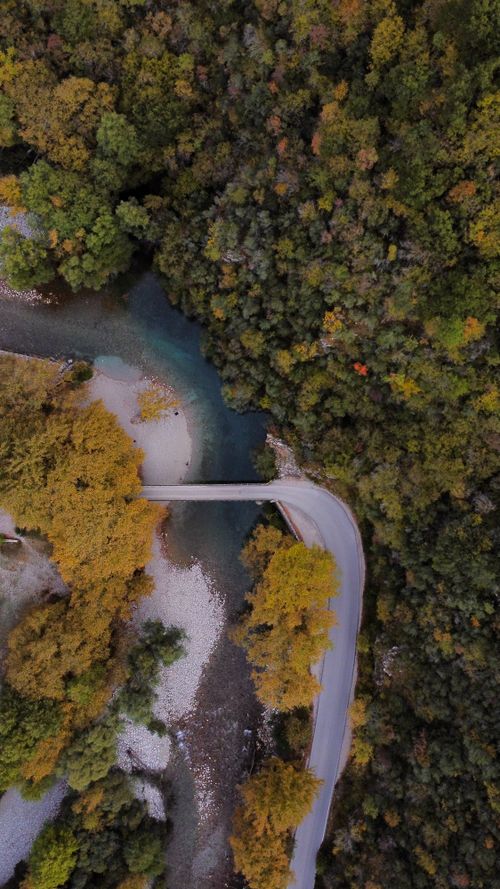 Free Discover the tranquility of a Greek forest landscape from above with a winding river. Stock Photo
