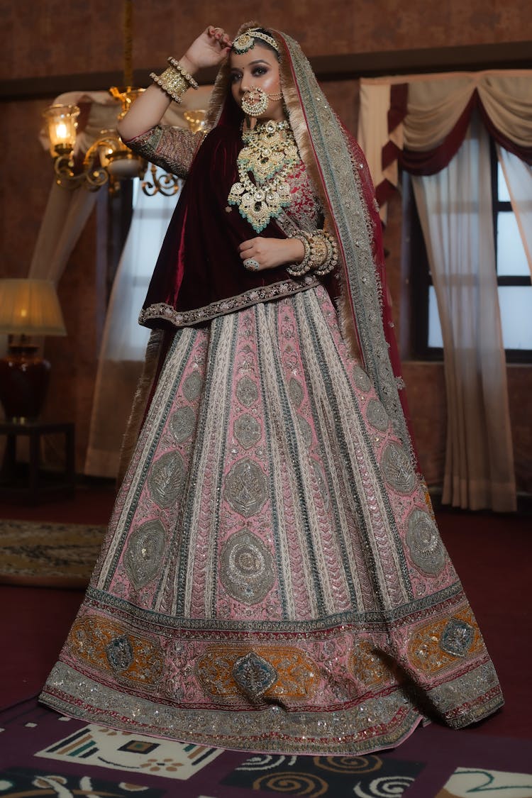 A Woman In Pink And Red Saree