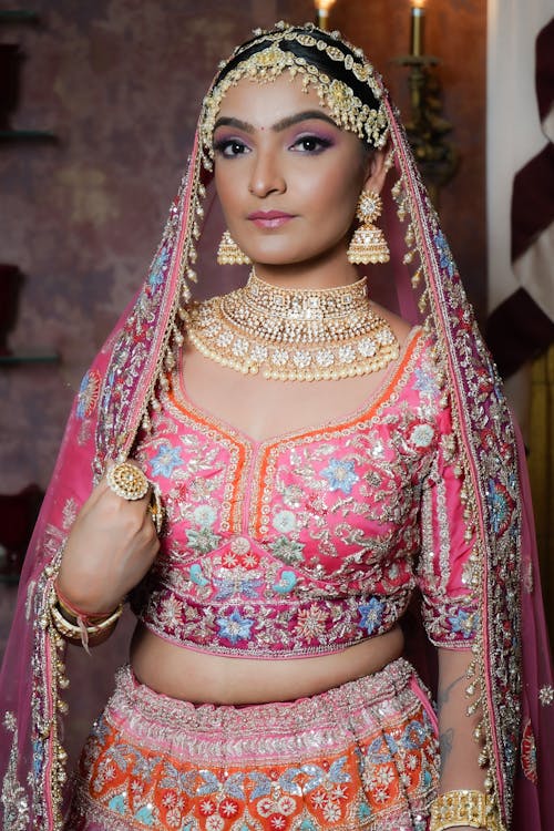 A Pretty Woman in Pink and Red Saree