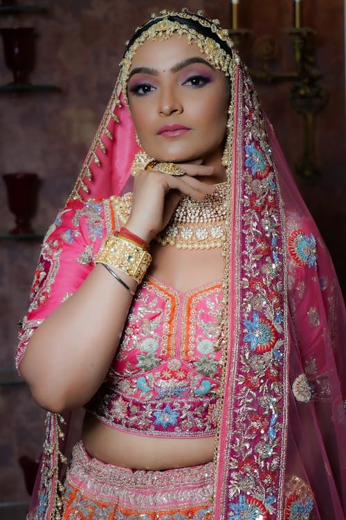 An Elegant Woman in Pink and Red Saree